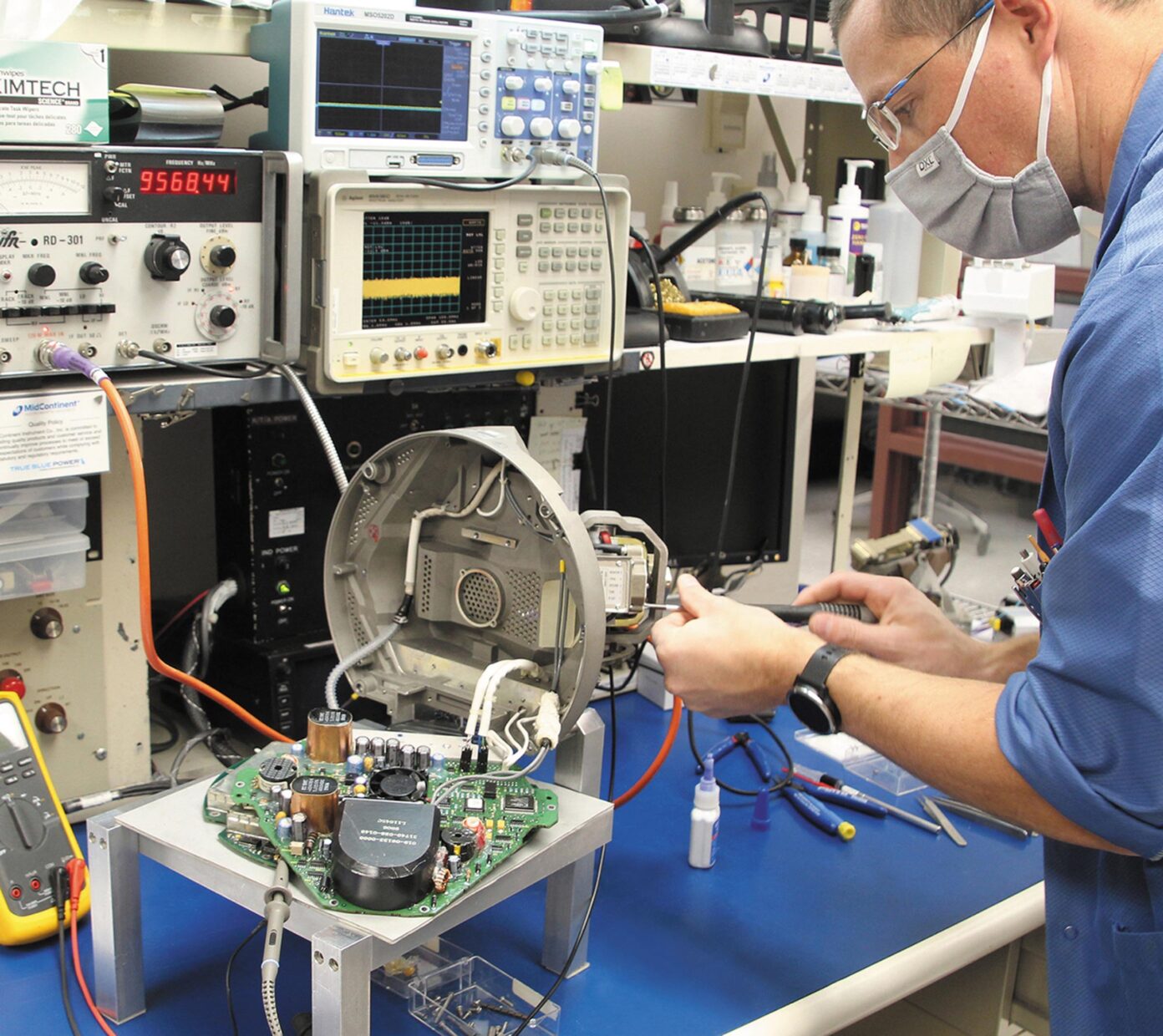 Technician working on used avionics